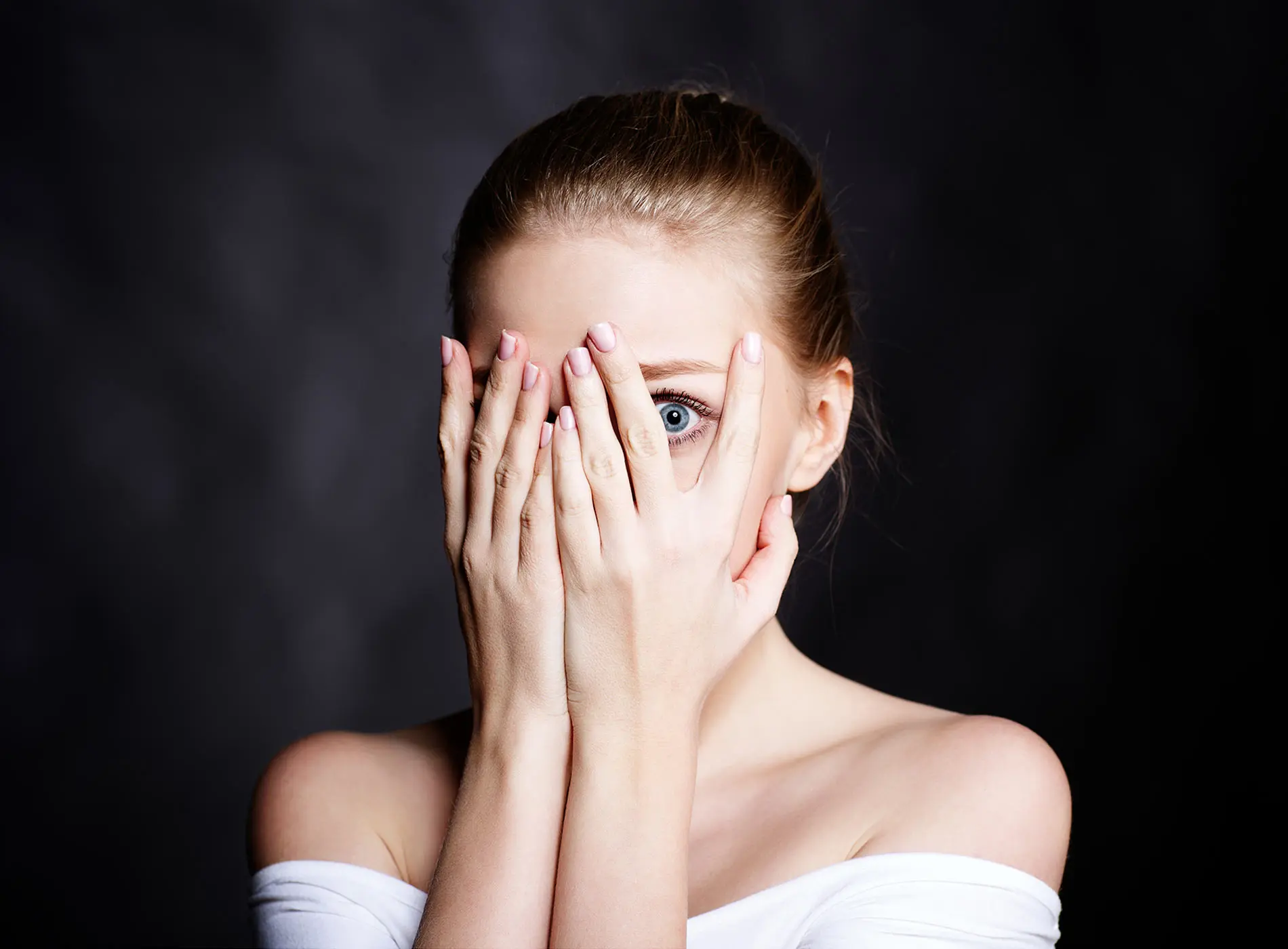 A woman covered her face with fear.jpg