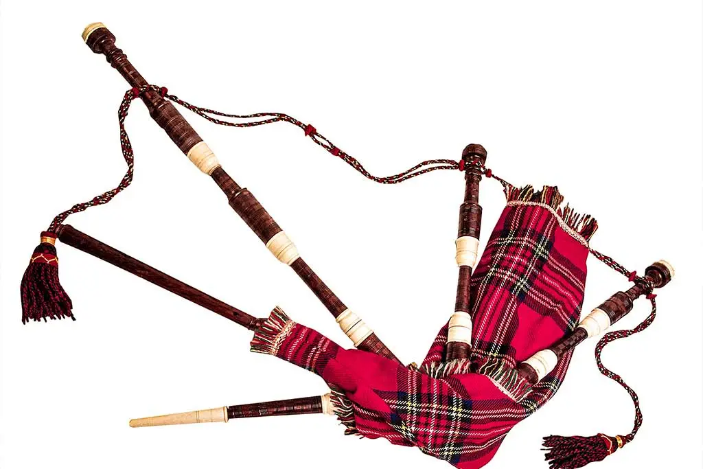 Bagpipes with a red tartan bag and drones