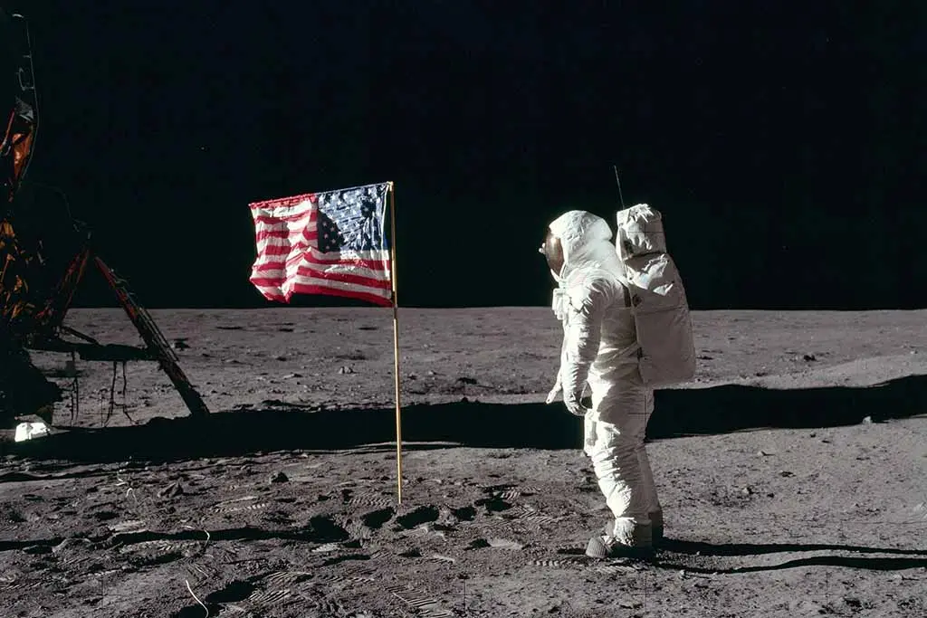 Image of Buzz Aldrin salutes the deployed US flag on the lunar surface