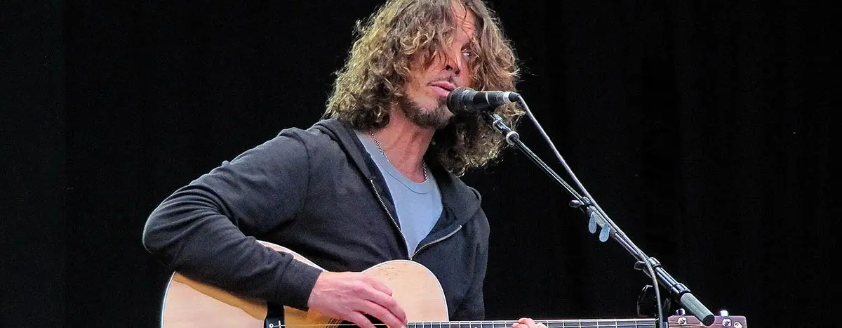 Chris Cornell singing and playing guitar