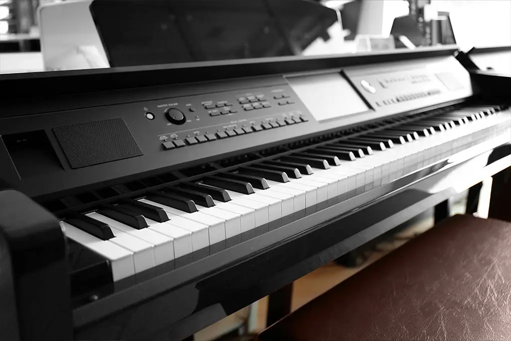 Close-up of a digital piano keyboard and controls