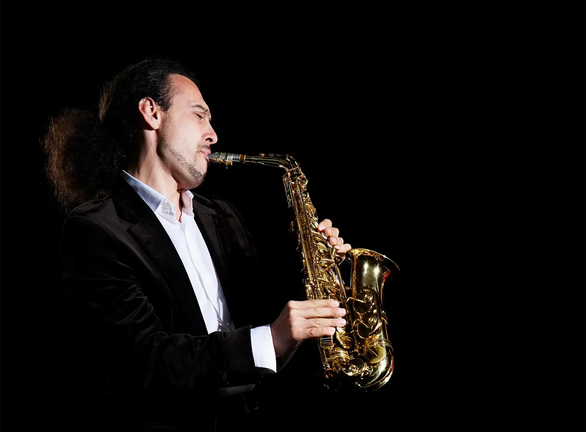 Man passionately playing the saxophone