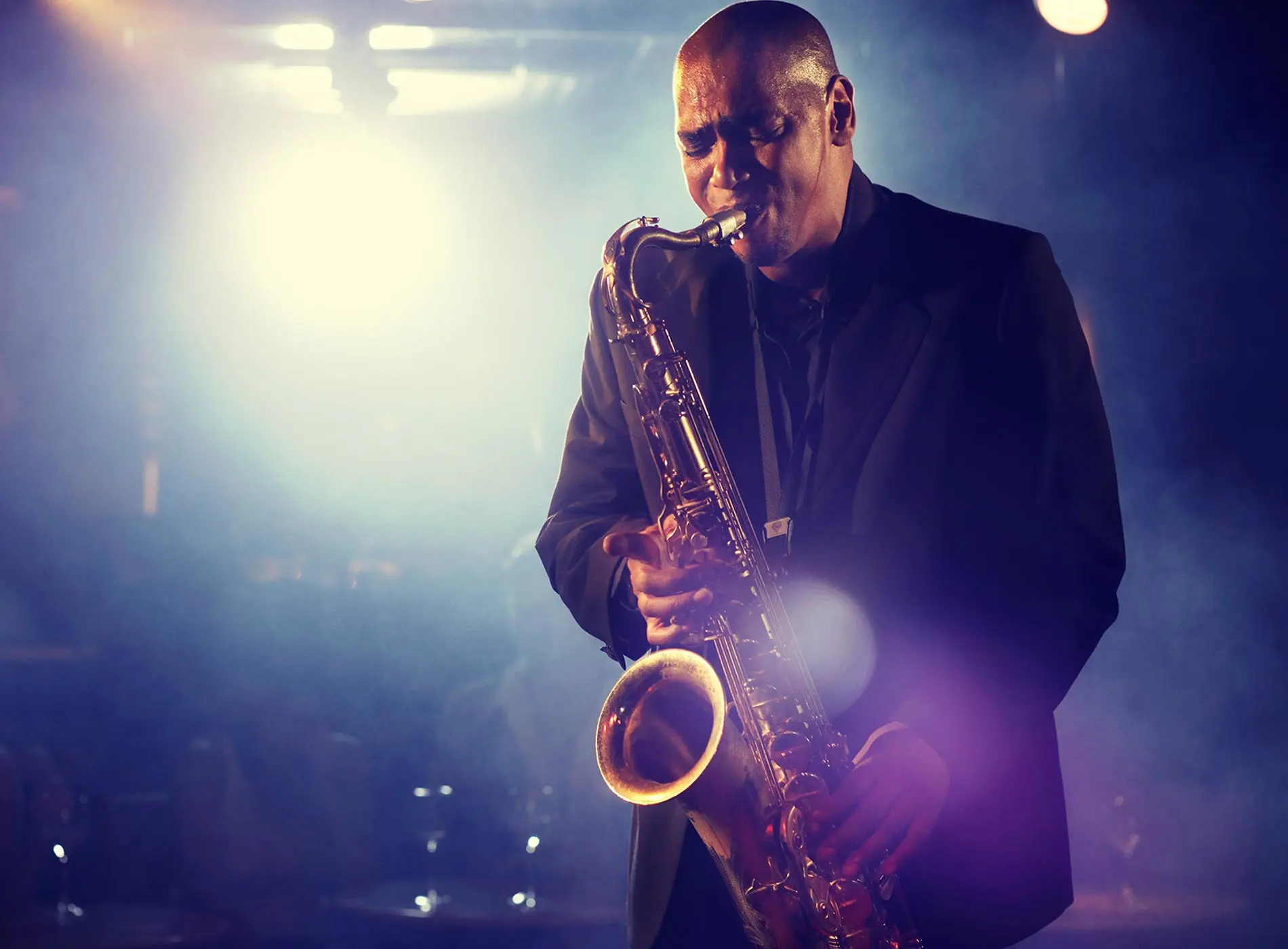 Man playing saxophone on stage