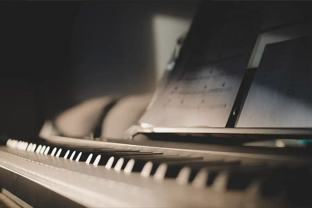 Piano with sheet music on top