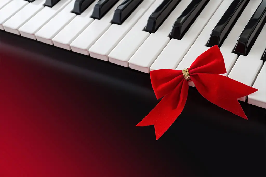 Red ribbon on the piano keyboard
