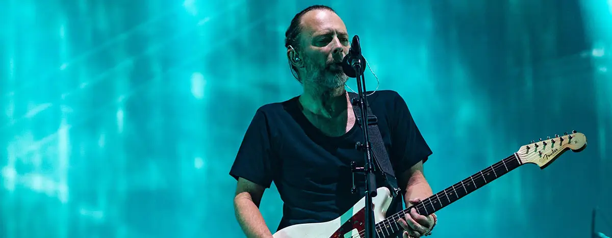 Thom Yorke singing and performing on stage