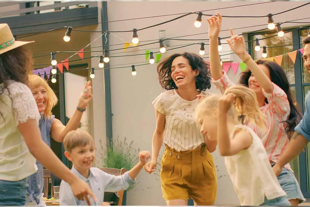 Image of whole family dancing happily